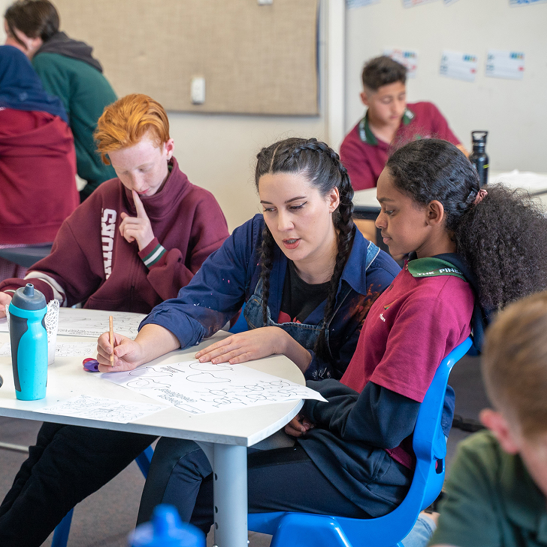 Artists Ruby Chew working with students in classroom