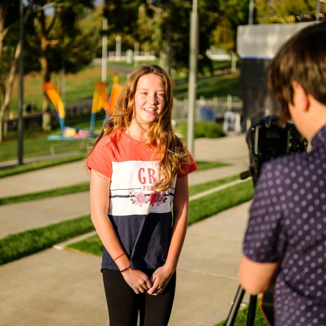 A young female speaking on camera
