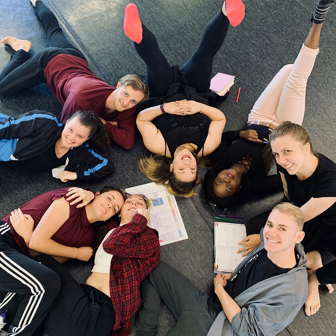 the Art Squad members lying on the ground looking up
