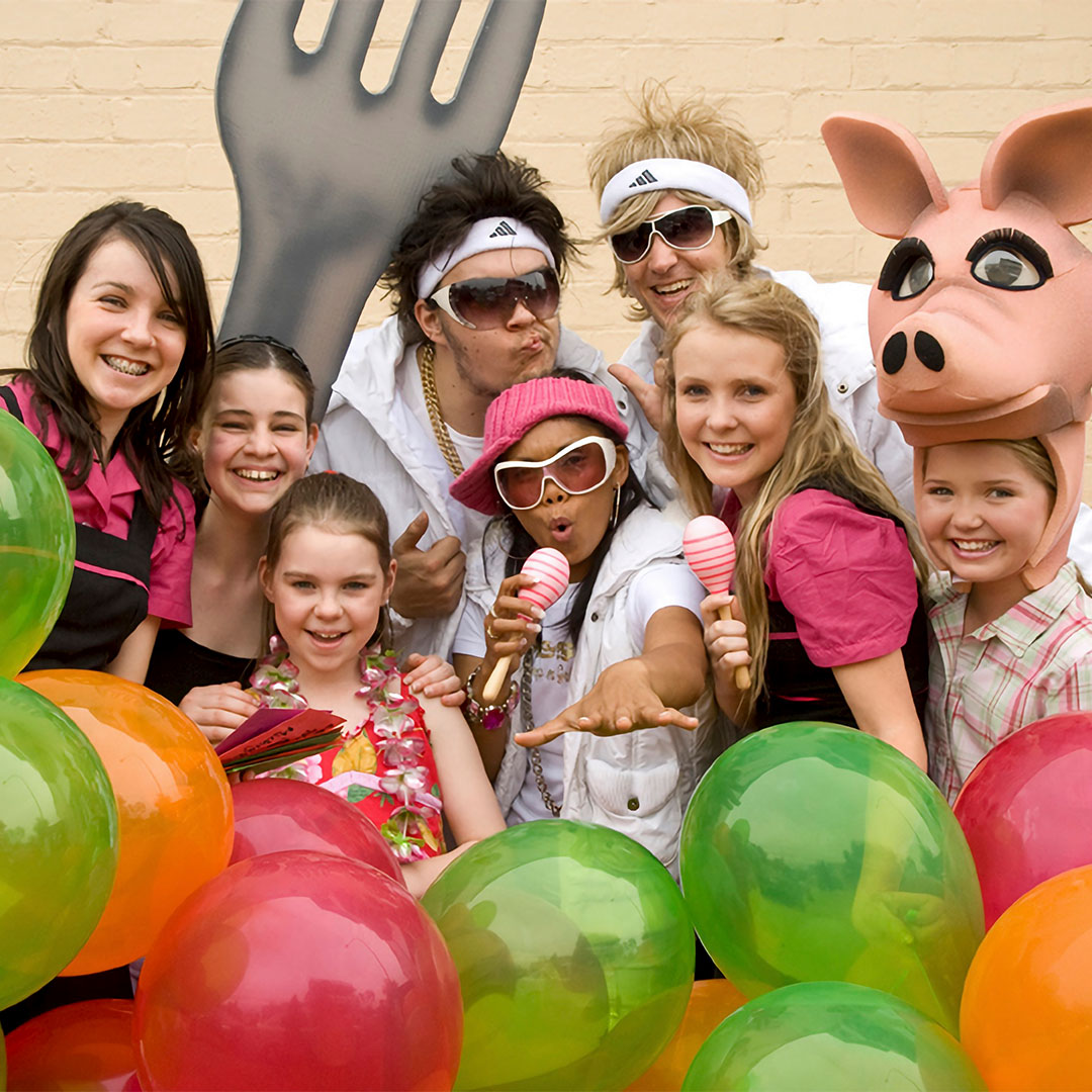 Swell Productions and State Opera members posing with children