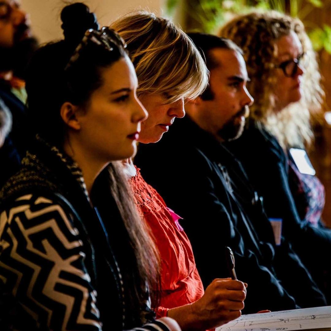 Artists sitting during a lecture