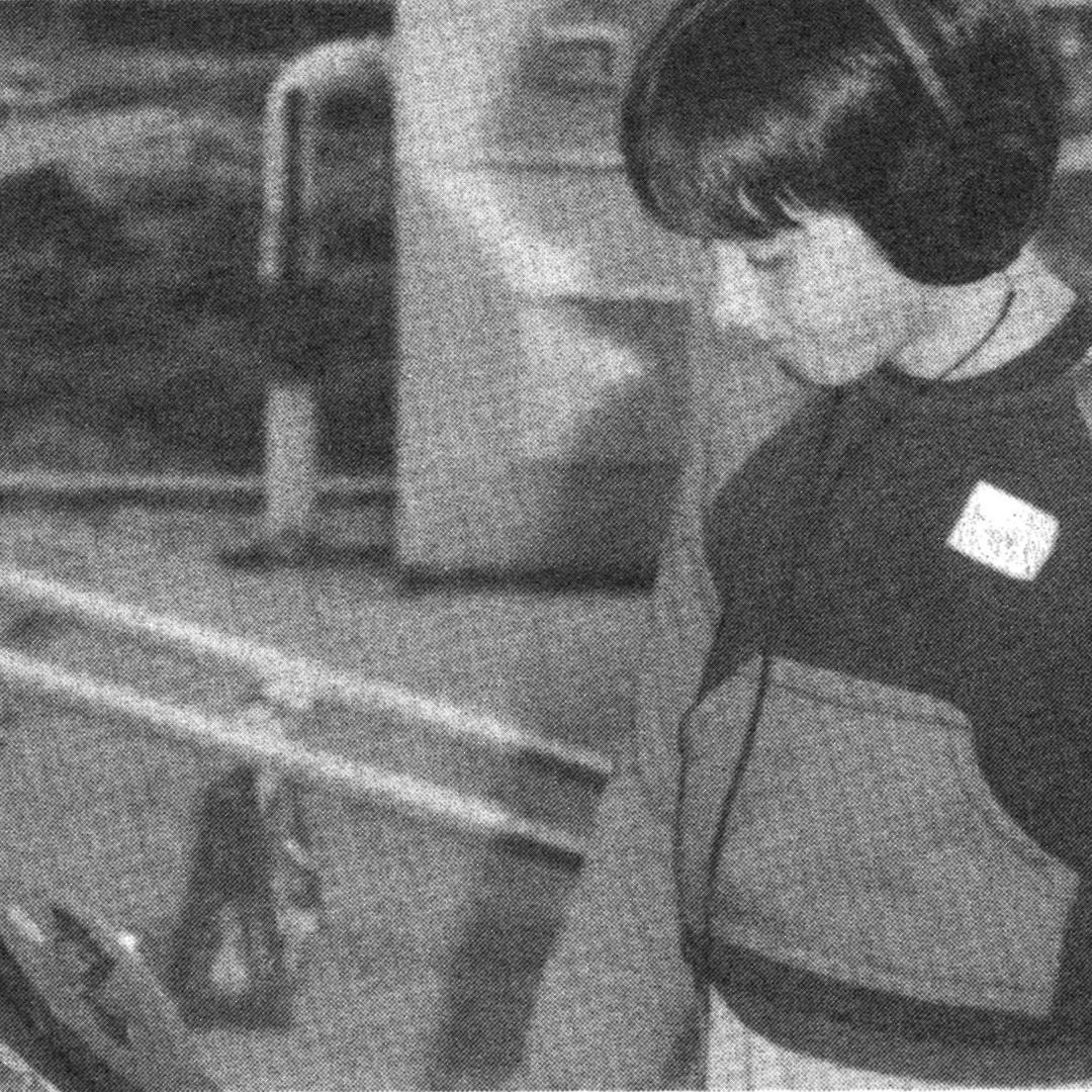 Black and white photo of a boy wearing headphones